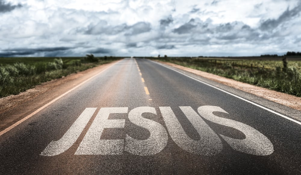 Jesus written on rural road